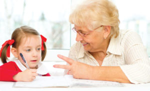 grandmother-helping-girl-homework